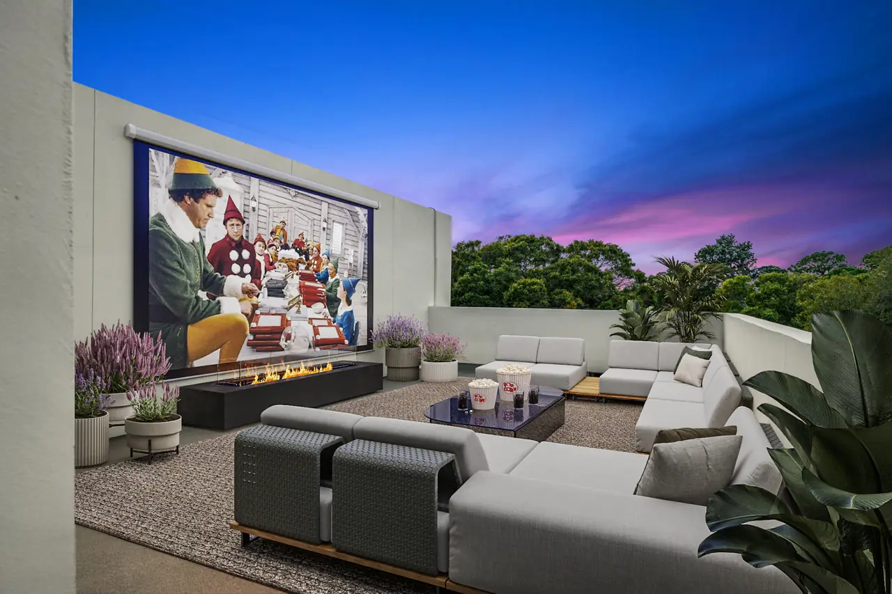 Rooftop terrace set up for an evening screening with lounge seating at Latitudes in the Park, Pinellas Park FL